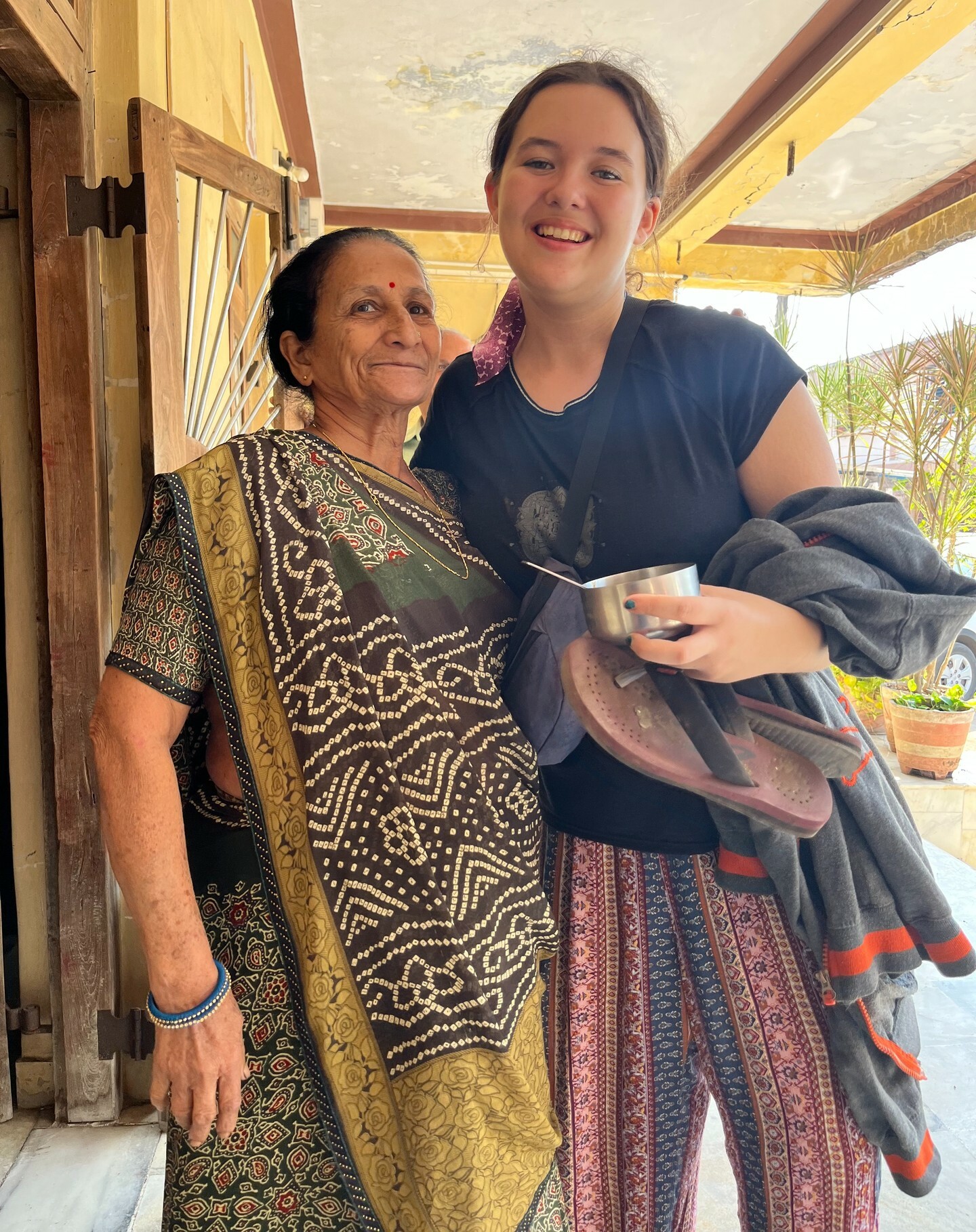 YES Abroad student smiling and embracing her host mother