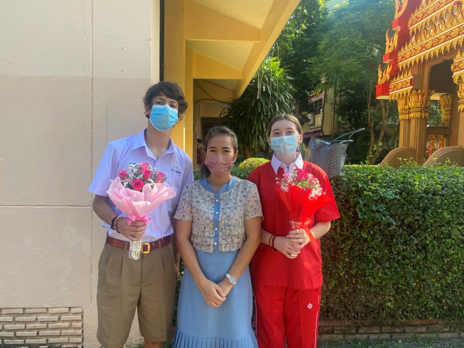 Carsyn at school with teacher and classmate.