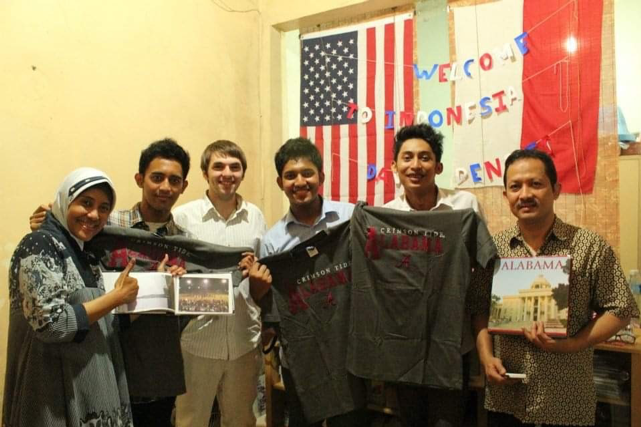 David giving gifts to his Indonesian host family