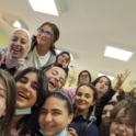 YES Abroad student Gaby with 12 classmates in Jordan