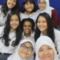 YES Abroad student, Victoria, with a group of students at her host school in Indonesia