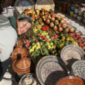 Caroline posing with pottery on display outside a shop